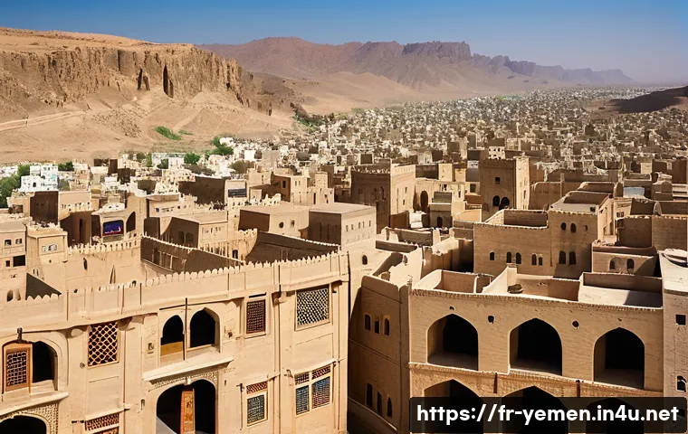 예멘의 유적 복원 프로젝트 - A panoramic view of the ancient fortified city of Shibam in Yemen, featuring towering mudbrick skysc...